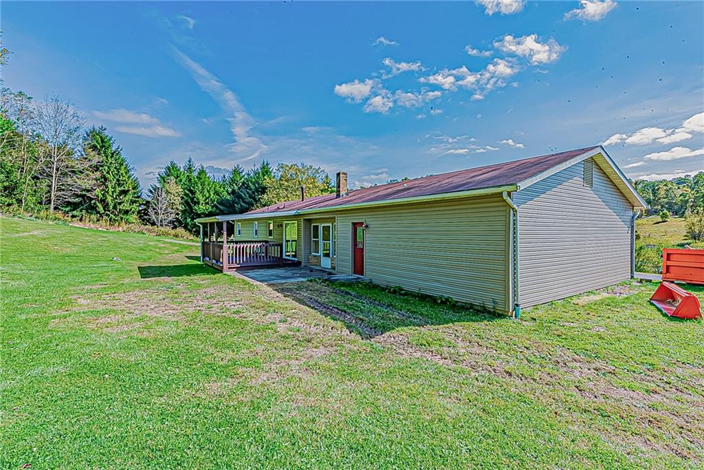 510 Crooks Road Home, PA 15747 - Photo 15 of 20 a view of a house with backyard and sitting area