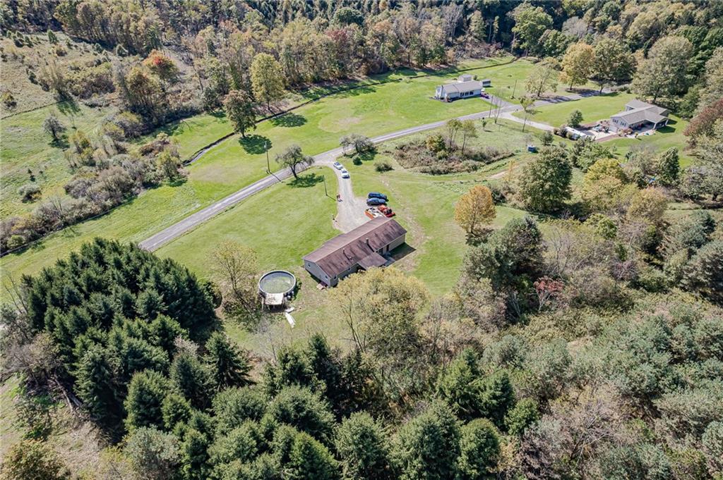 510 Crooks Road Home, PA 15747 - Photo 19 of 20 an aerial view of a house with a yard and trees all around