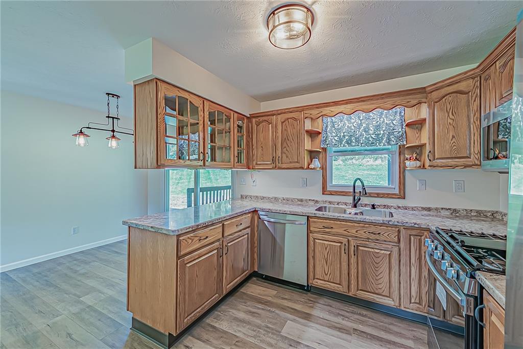 510 Crooks Road Home, PA 15747 - Photo 4 of 20 a kitchen with a sink stove and cabinets