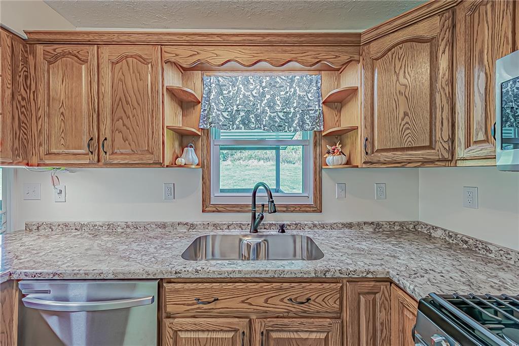 510 Crooks Road Home, PA 15747 - Photo 5 of 20 a kitchen with granite countertop a sink and a granite counter tops