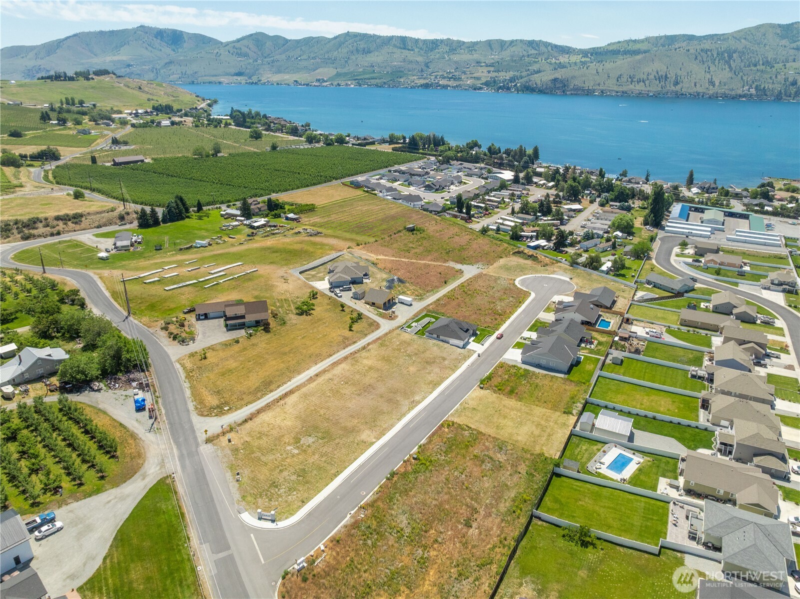 58 Sailing Hawk Lane Manson, WA 98831 - Photo 11 of 36 an aerial view of a pool lake view and mountain view