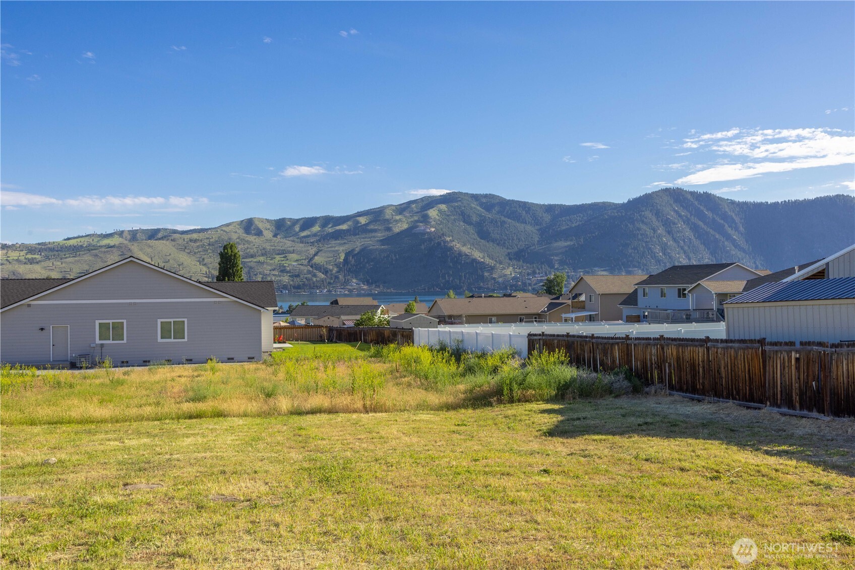 58 Sailing Hawk Lane Manson, WA 98831 - Photo 2 of 36 a view of a house with pool and a yard
