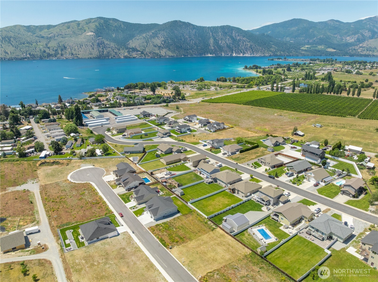 58 Sailing Hawk Lane Manson, WA 98831 - Photo 22 of 36 a view of a city with a lake