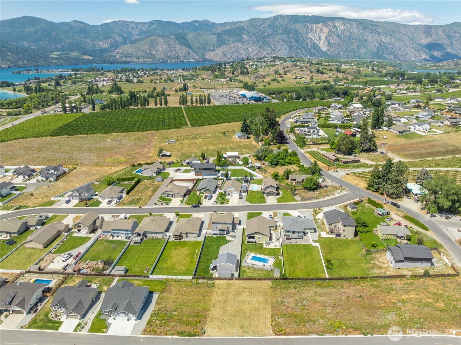 58 Sailing Hawk Lane Manson, WA 98831 - Photo 26 of 36 a view of an aerial view of residential houses with outdoor space and mountain view