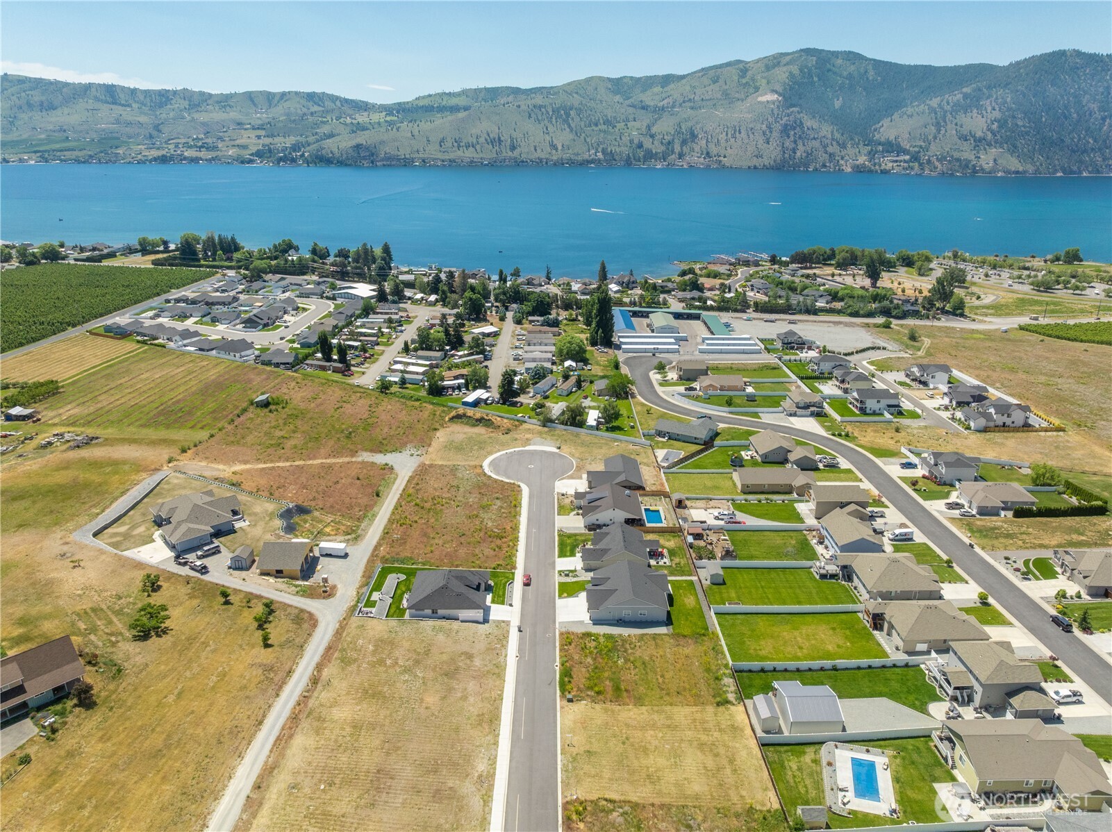 58 Sailing Hawk Lane Manson, WA 98831 - Photo 32 of 36 a view of a city with an ocean view