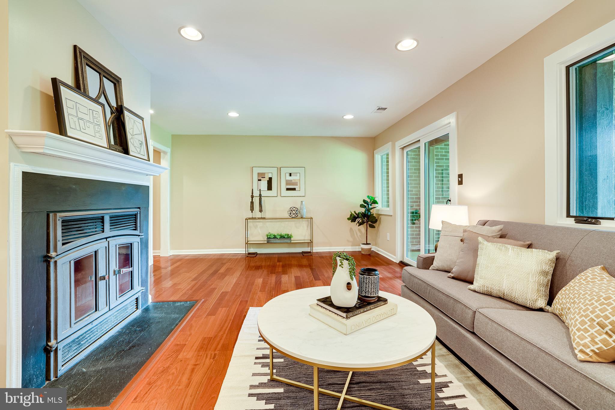 11056 Thrush Ridge Road Reston, VA 20191 - Photo 47 of 62 a living room with furniture and a wooden floor