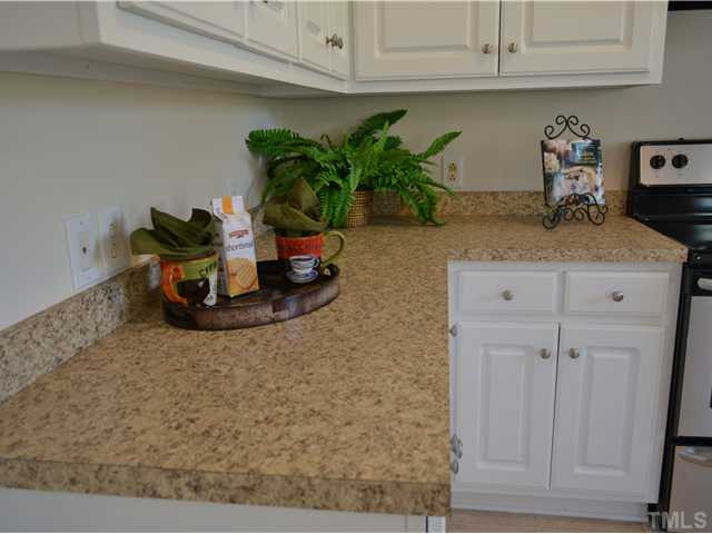 5660 Zacks Mill Road Angier, NC 27501 - Photo 12 of 24 Wow, the list goes on, new kitchen counter tops with lots of space, new cabinet knobs to dress up the cabinets too. Kitchen