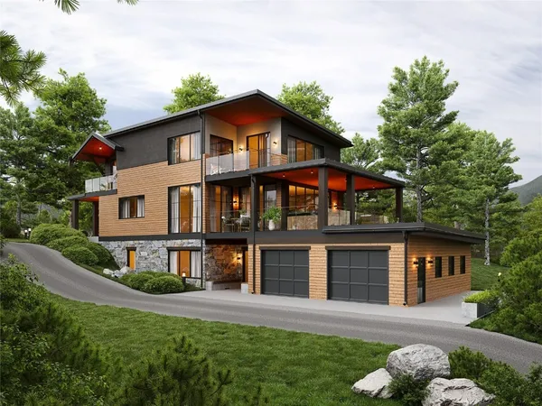 a front view of a house with a yard and trees