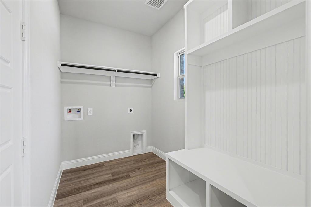 7041 Champion Road Midlothian, TX 76065 - Photo 21 of 30 a view of small space with racks on the wall