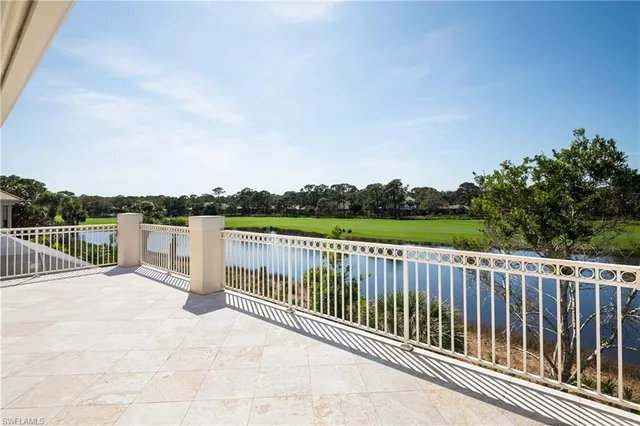 a view of a roof with wooden fence