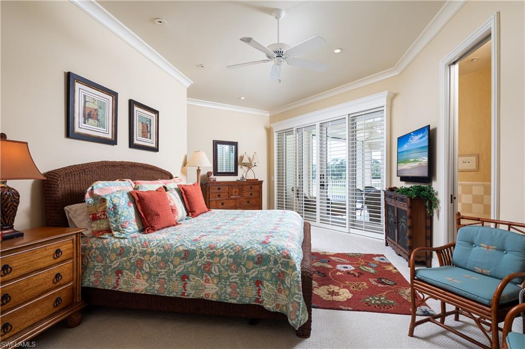 980 Barcarmil Way Naples, FL 34110 - Photo 29 of 50 a bedroom with a bed and a couch