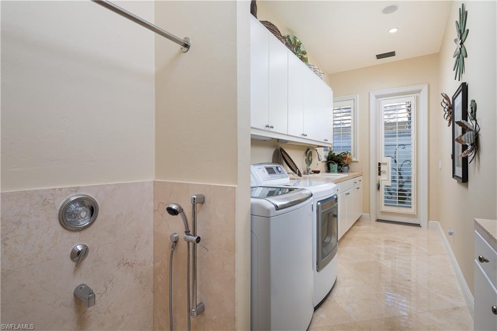 980 Barcarmil Way Naples, FL 34110 - Photo 31 of 50 a view of a kitchen with refrigerator and window
