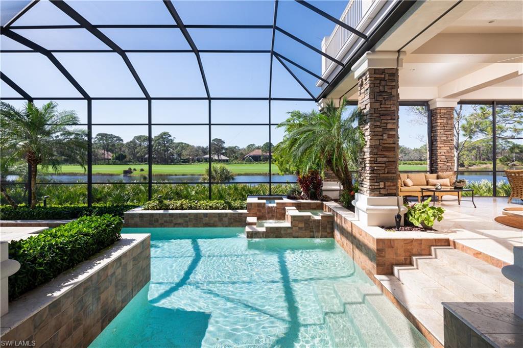 980 Barcarmil Way Naples, FL 34110 - Photo 34 of 50 a view of a patio with couches and potted plants