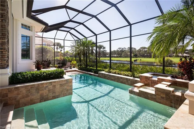 a view of house with a yard and furniture