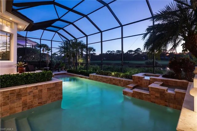 a view of a swimming pool with a patio