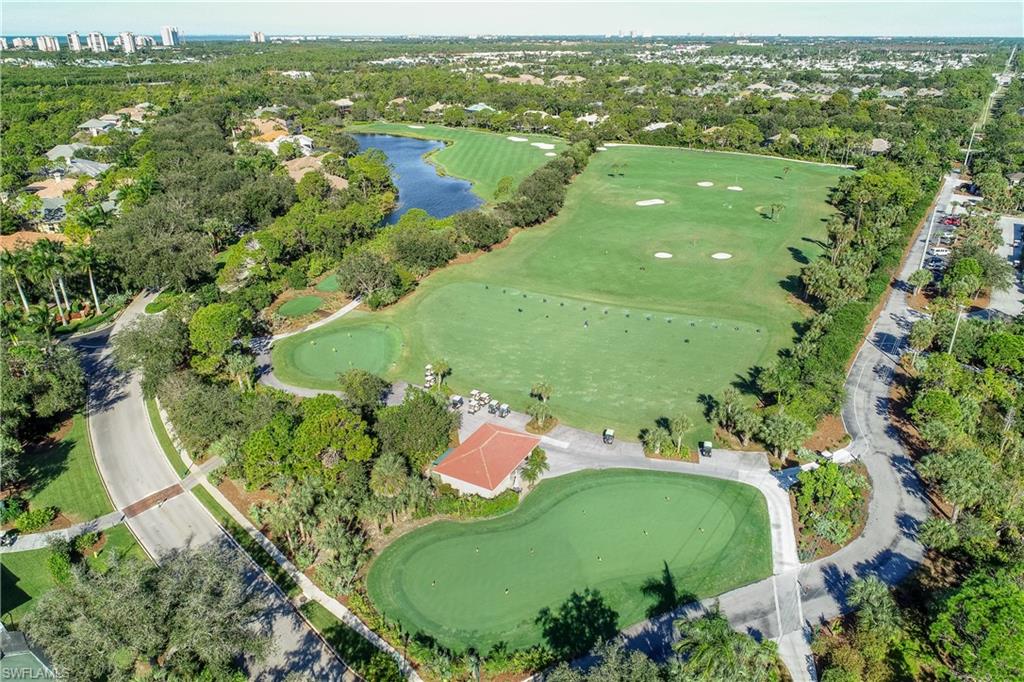 980 Barcarmil Way Naples, FL 34110 - Photo 46 of 50 an aerial view of a golf course with parking space
