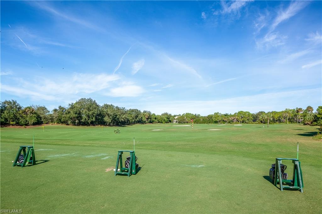 980 Barcarmil Way Naples, FL 34110 - Photo 47 of 50 a view of a lake with a yard