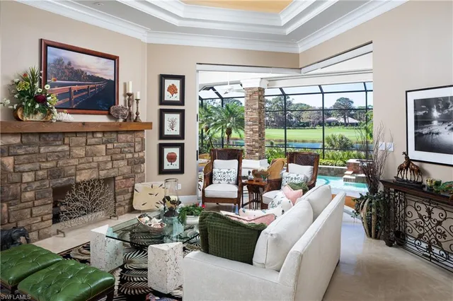 a living room with furniture large window and flat screen tv