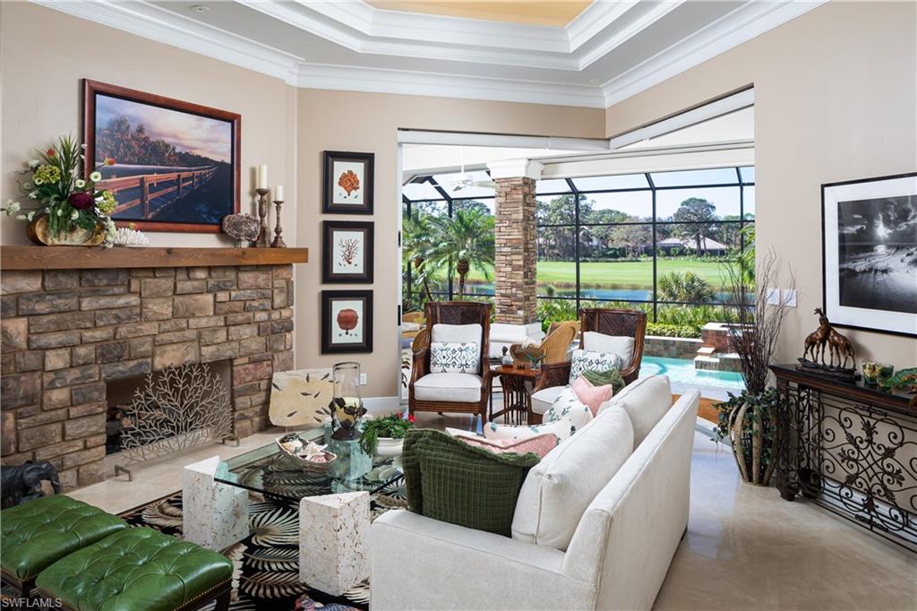 980 Barcarmil Way Naples, FL 34110 - Photo 6 of 50 a living room with furniture large window and flat screen tv