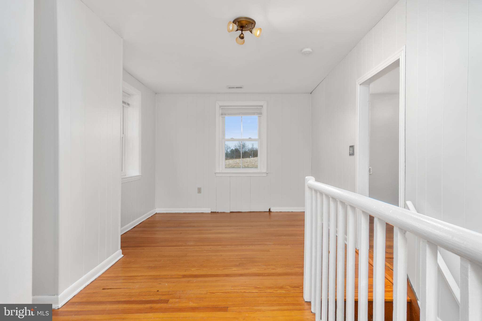 2730 Marker Road Middletown, MD 21769 - Photo 29 of 73 a view of a hallway with wooden floor