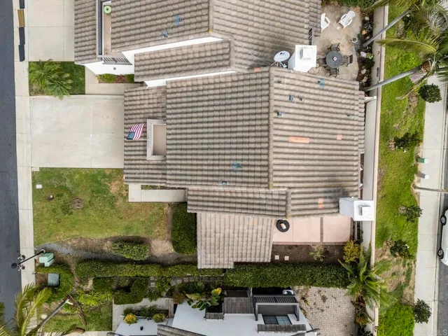 a front view of a house with sitting area