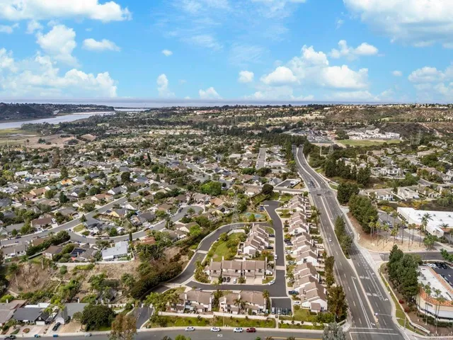 an aerial view of residential building with yard