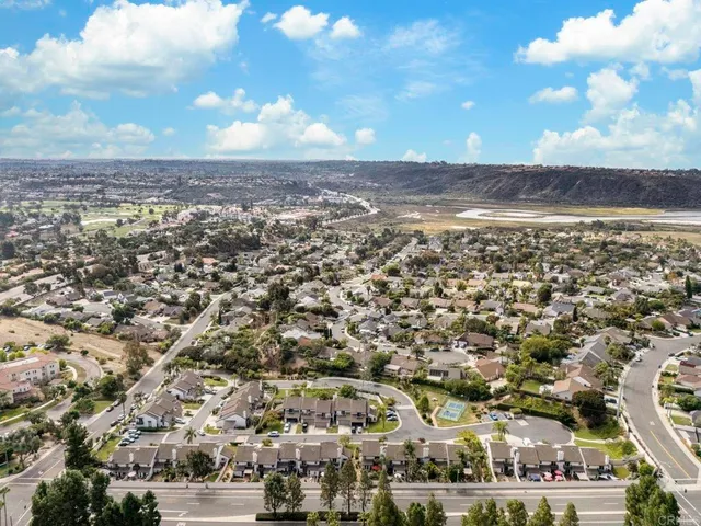 an aerial view of residential building with ocean view