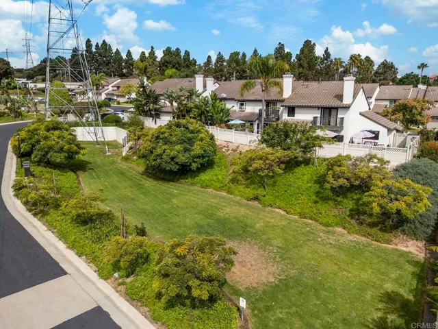 a view of a garden with houses