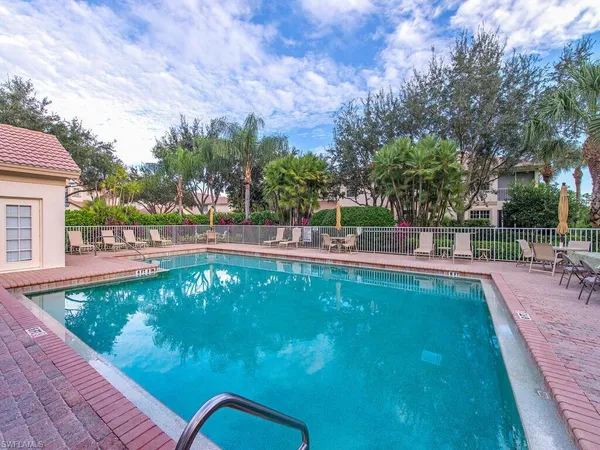 a view of a swimming pool with a patio