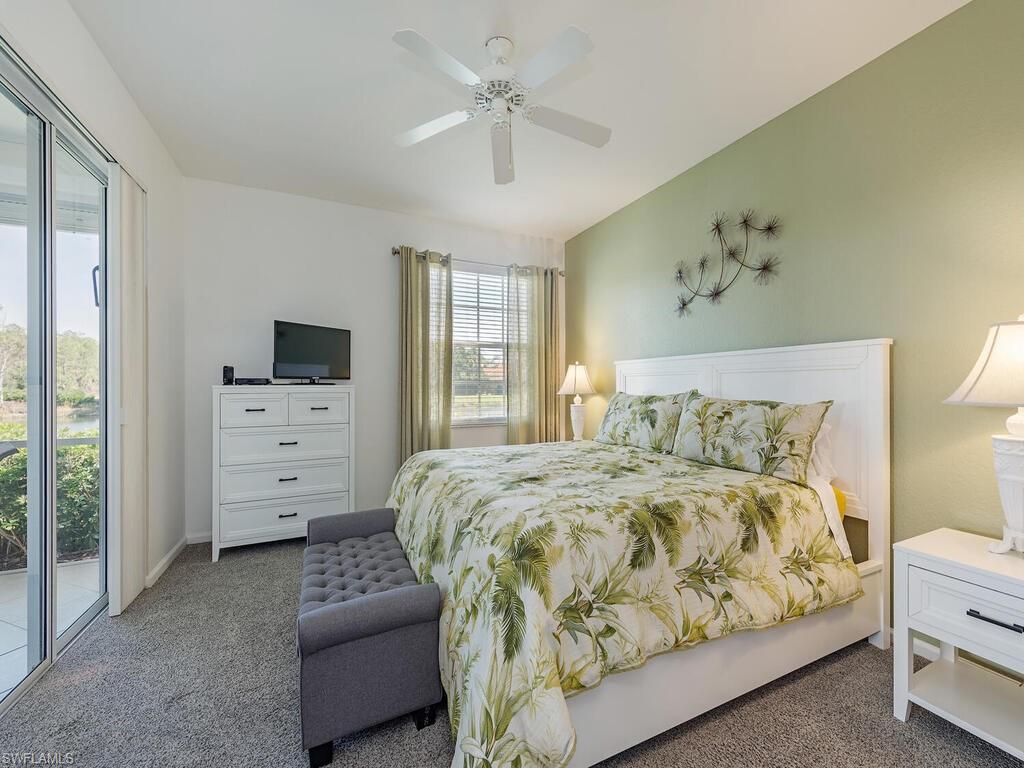 22911 Rosedale Drive, Unit 101 Estero, FL 34135 - Photo 8 of 15 Spacious Primary bedroom with access to lanai and lake views