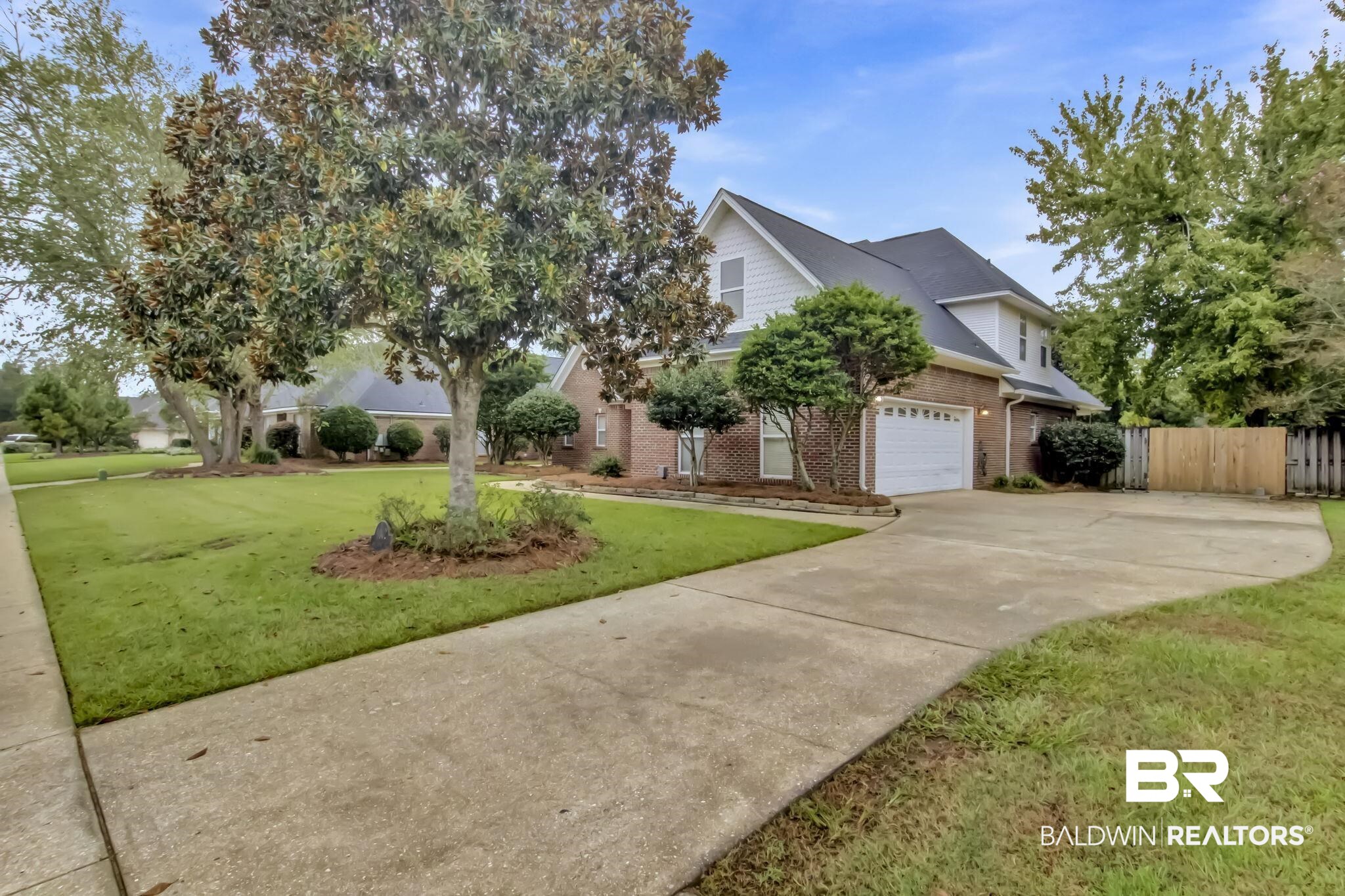 9002 Parliament Circle Daphne, AL 36526 - Photo 2 of 73 View of front facade featuring a garage and a front yard