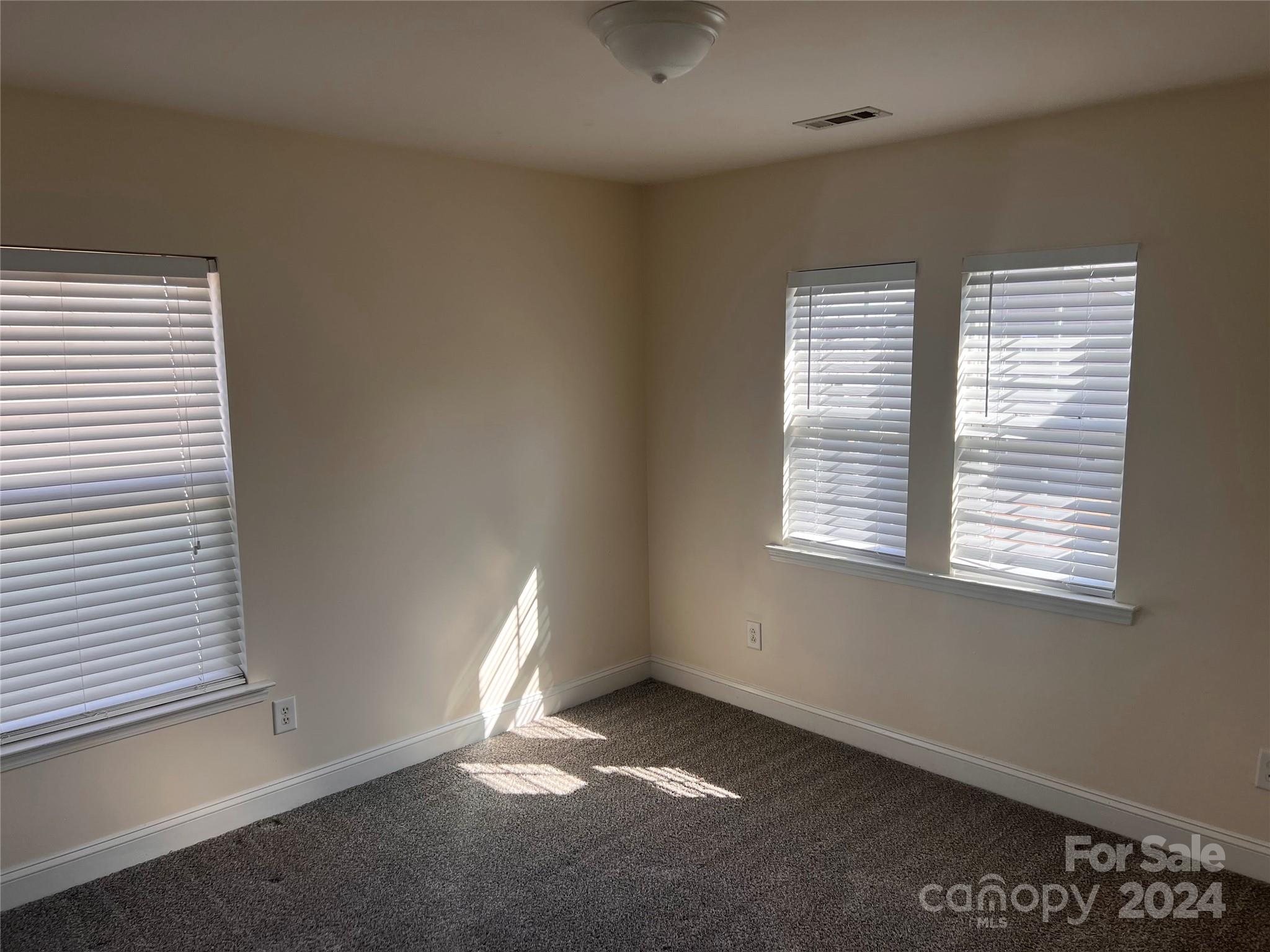 6706 Ferrell Commons Road Charlotte, NC 28269 - Photo 11 of 22 an empty room with a window