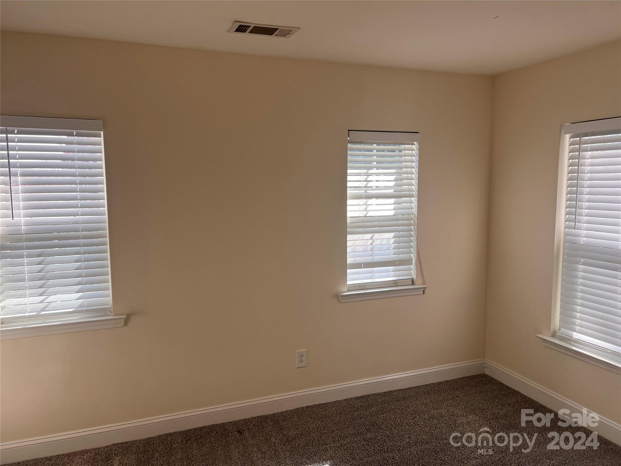 6706 Ferrell Commons Road Charlotte, NC 28269 - Photo 12 of 22 a view of an empty room with a window