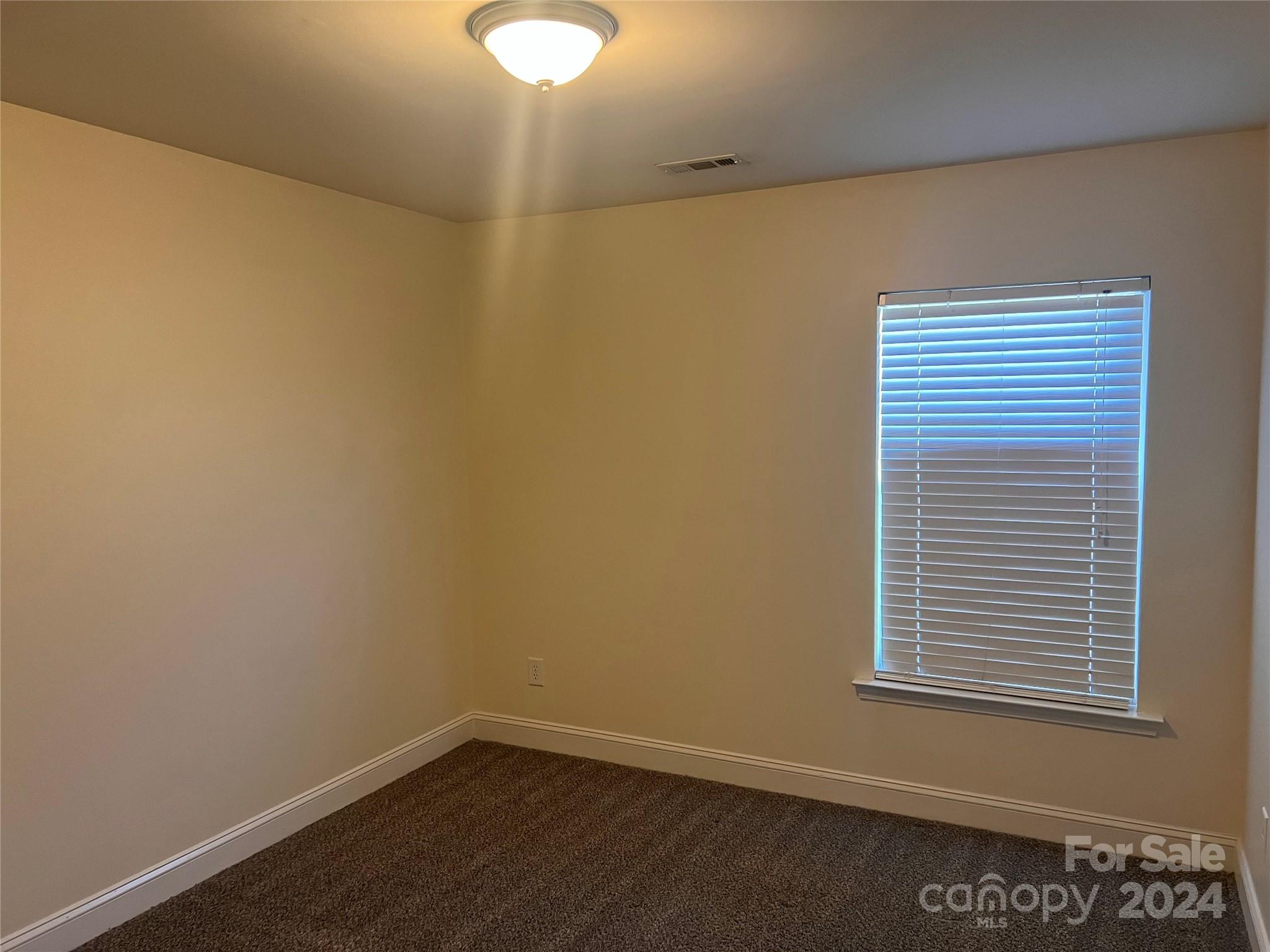 6706 Ferrell Commons Road Charlotte, NC 28269 - Photo 13 of 22 a view of a small space with a window