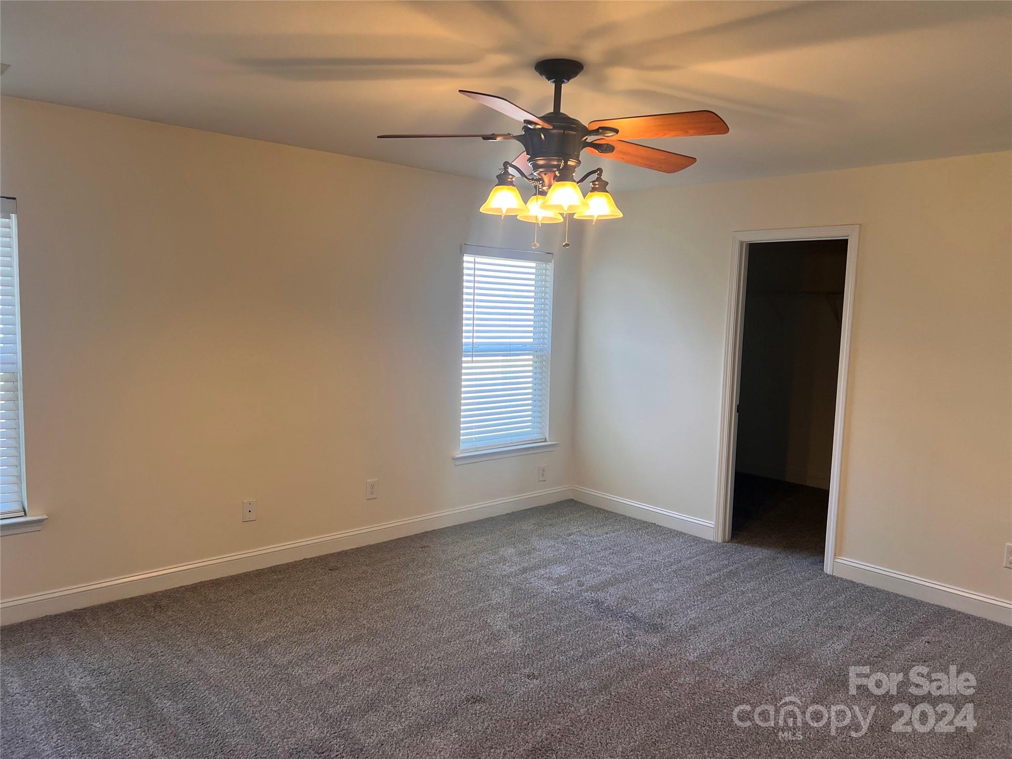 6706 Ferrell Commons Road Charlotte, NC 28269 - Photo 17 of 22 a view of a chandelier fan in a room