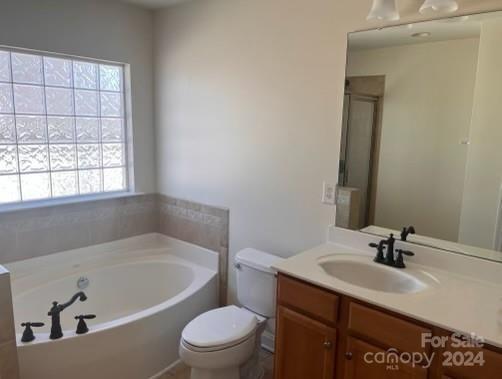 6706 Ferrell Commons Road Charlotte, NC 28269 - Photo 19 of 22 a bathroom with a sink toilet and bathtub