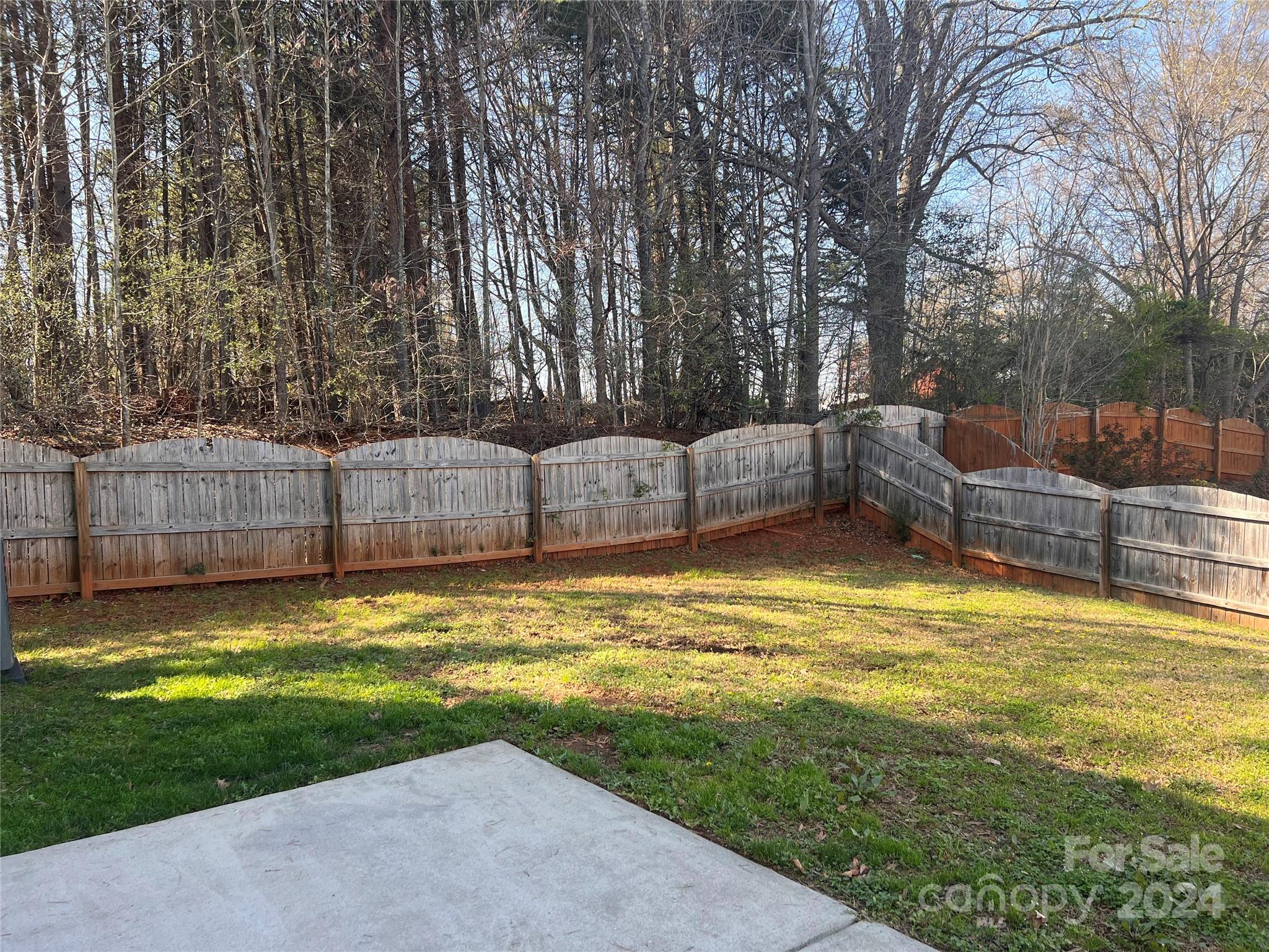 6706 Ferrell Commons Road Charlotte, NC 28269 - Photo 20 of 22 a view of a swimming pool with a yard