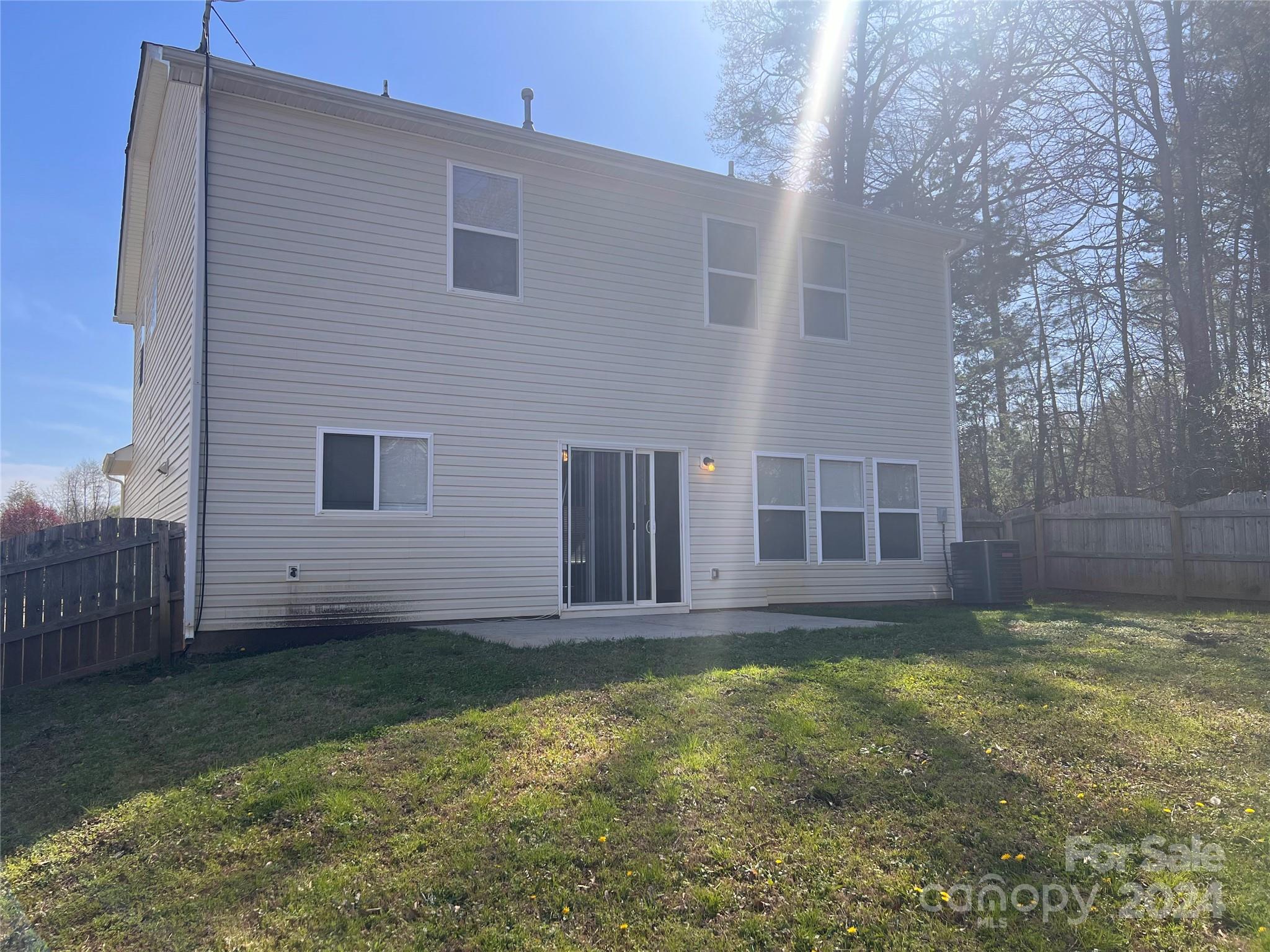 6706 Ferrell Commons Road Charlotte, NC 28269 - Photo 22 of 22 a view of a house with a yard