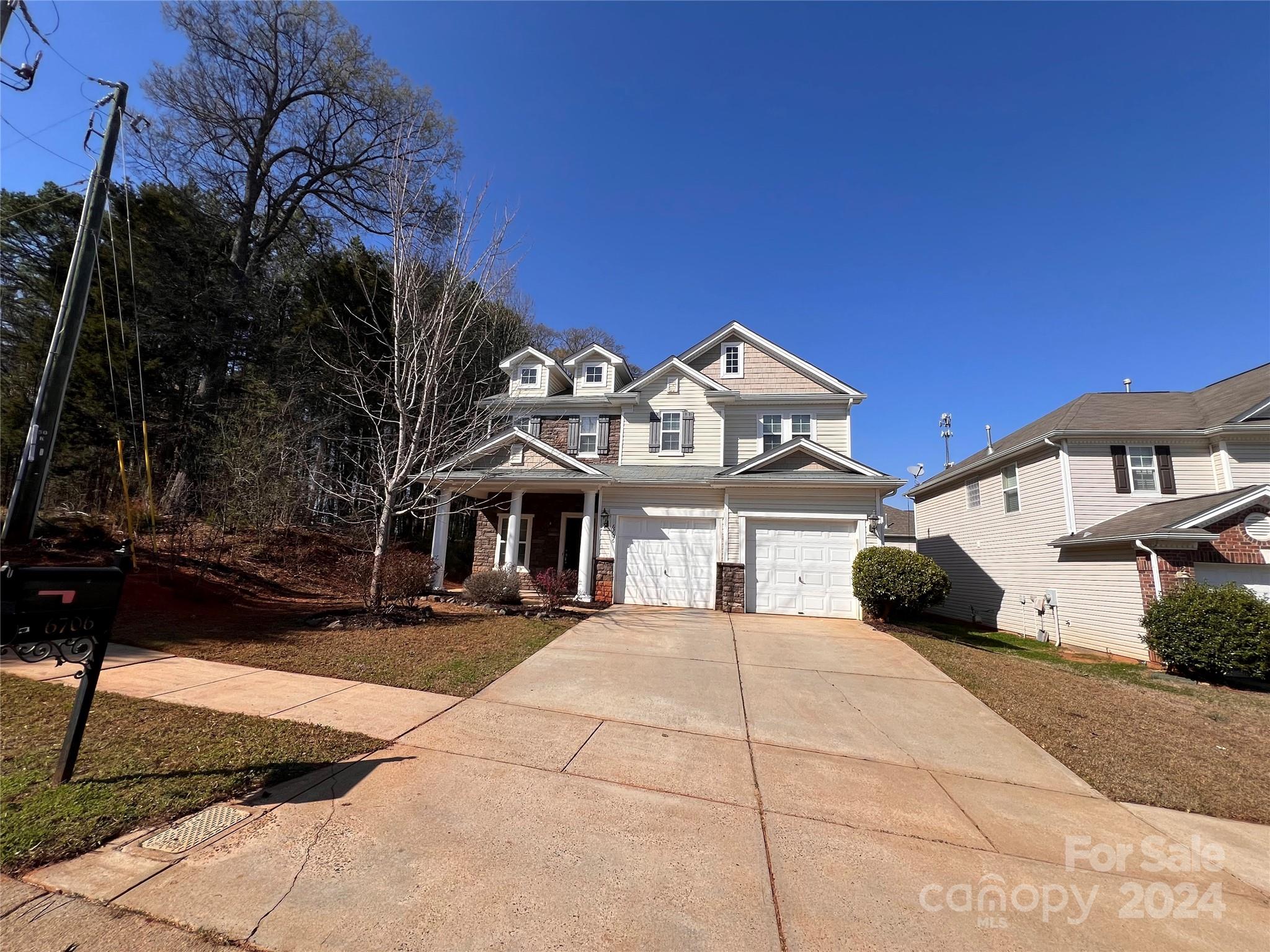 6706 Ferrell Commons Road Charlotte, NC 28269 - Photo 3 of 22 a front view of a house with a yard