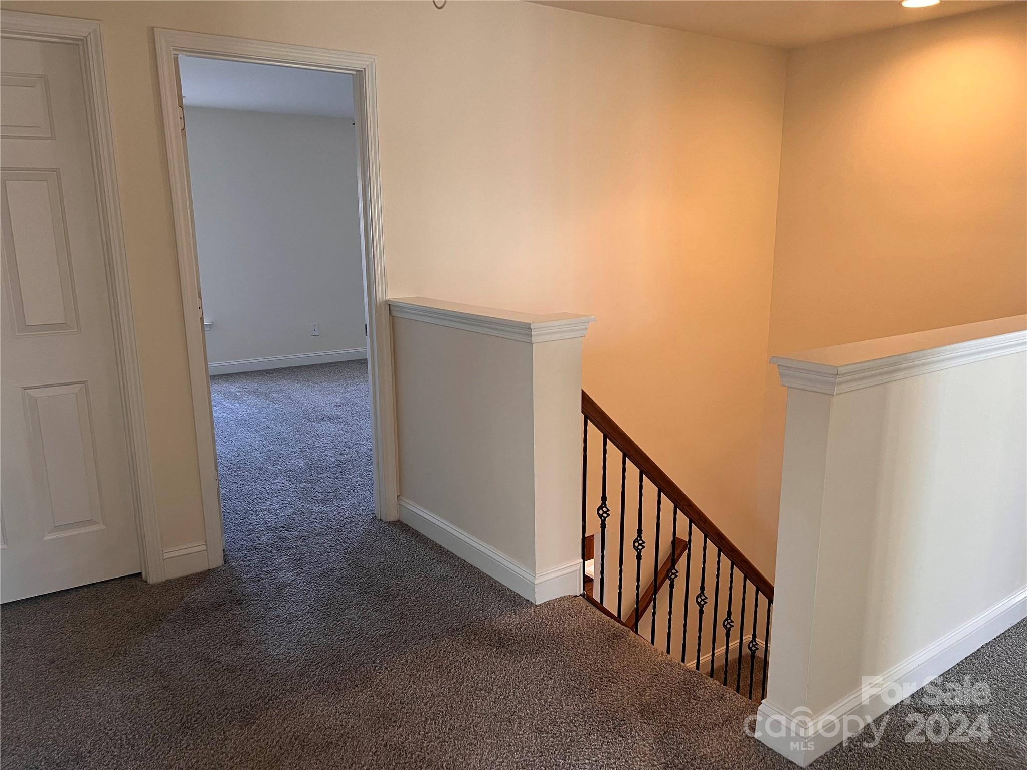 6706 Ferrell Commons Road Charlotte, NC 28269 - Photo 10 of 22 a view of a hallway with wooden floor and entryway