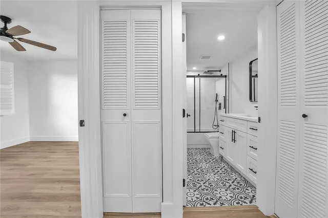 a bathroom with a shower and a sink