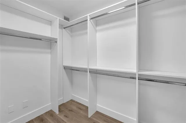 a view of an empty walk in closet