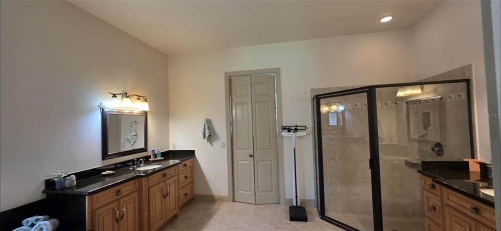 8991 Southwest Springhaven Avenue Indiantown, FL 34956 - Photo 12 of 30 a view of a hallway and a livingroom with furniture
