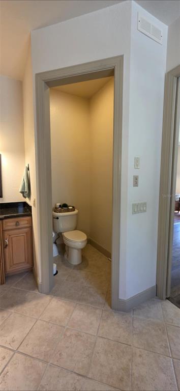 8991 Southwest Springhaven Avenue Indiantown, FL 34956 - Photo 14 of 30 a bathroom with a granite countertop sink and a toilet