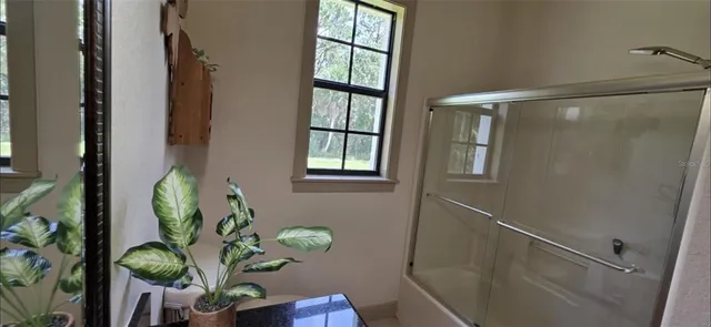 a view of an entryway with wooden floor