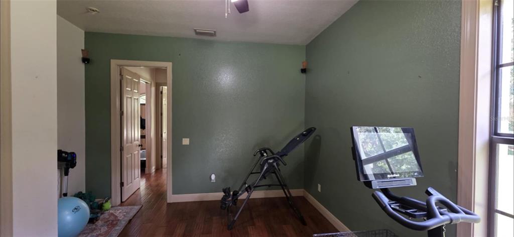 8991 Southwest Springhaven Avenue Indiantown, FL 34956 - Photo 23 of 30 a view of an entryway with wooden floor