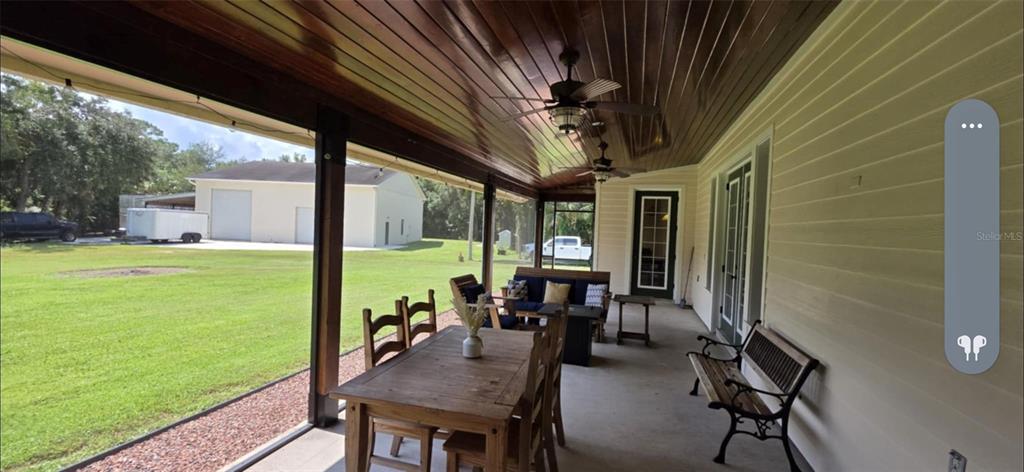 8991 Southwest Springhaven Avenue Indiantown, FL 34956 - Photo 26 of 30 a view of yard with patio