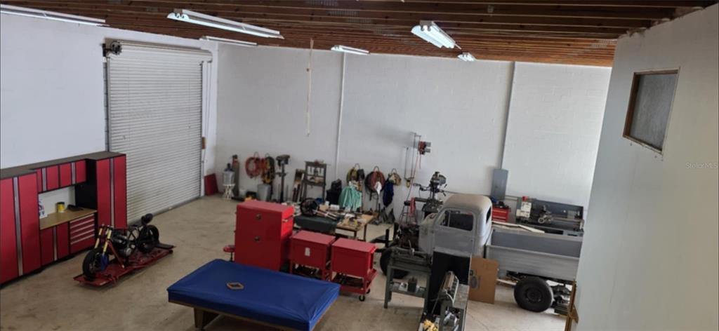 8991 Southwest Springhaven Avenue Indiantown, FL 34956 - Photo 29 of 30 a view of a workspace with furniture