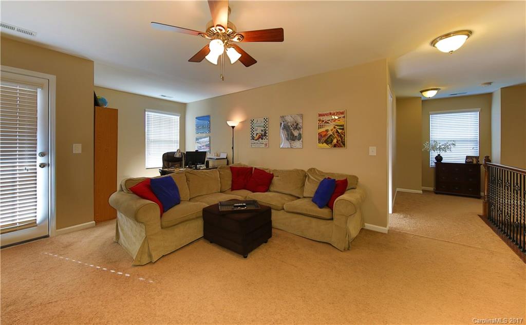 79291 Ridgehaven Road Lancaster, SC 29720 - Photo 18 of 23 a living room with furniture and a chandelier