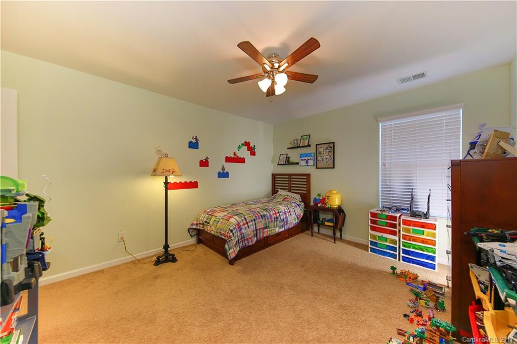 79291 Ridgehaven Road Lancaster, SC 29720 - Photo 22 of 23 a bedroom with furniture and a flat screen tv